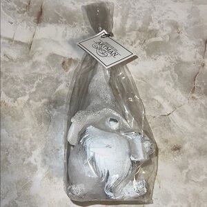Gnome Candle white, gray, and silver Christmas decoration with a sparkly hat.